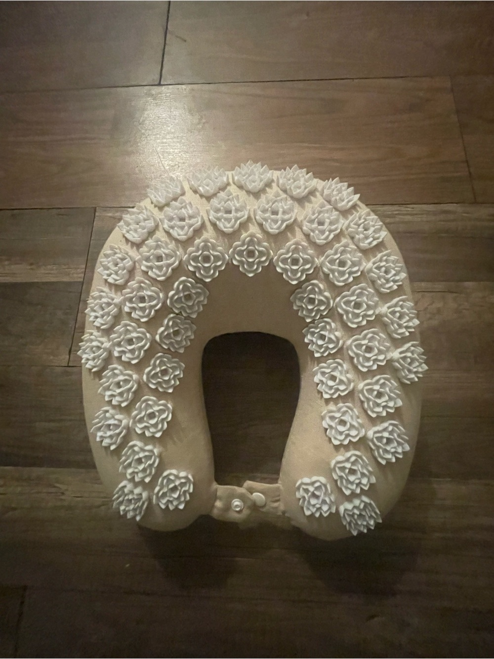 Kaboom Cream Neck Pillow with Decorative Flower Accents
